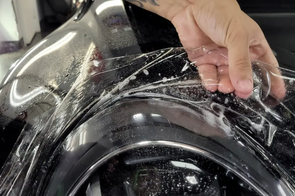 PPF — film squeegeed onto a hood